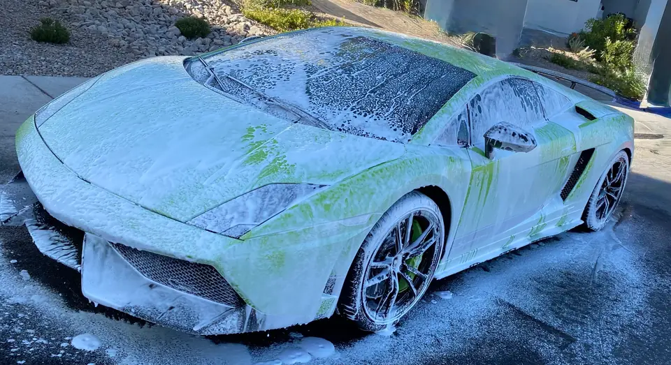 Vehicle covered in wash foam during a Luxe Mobile Detail service